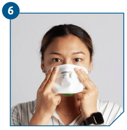 Using both hands, mould nose clip to the shape of your nose bridge by pushing inwards while moving your fingertips down both sides of the nosepiece